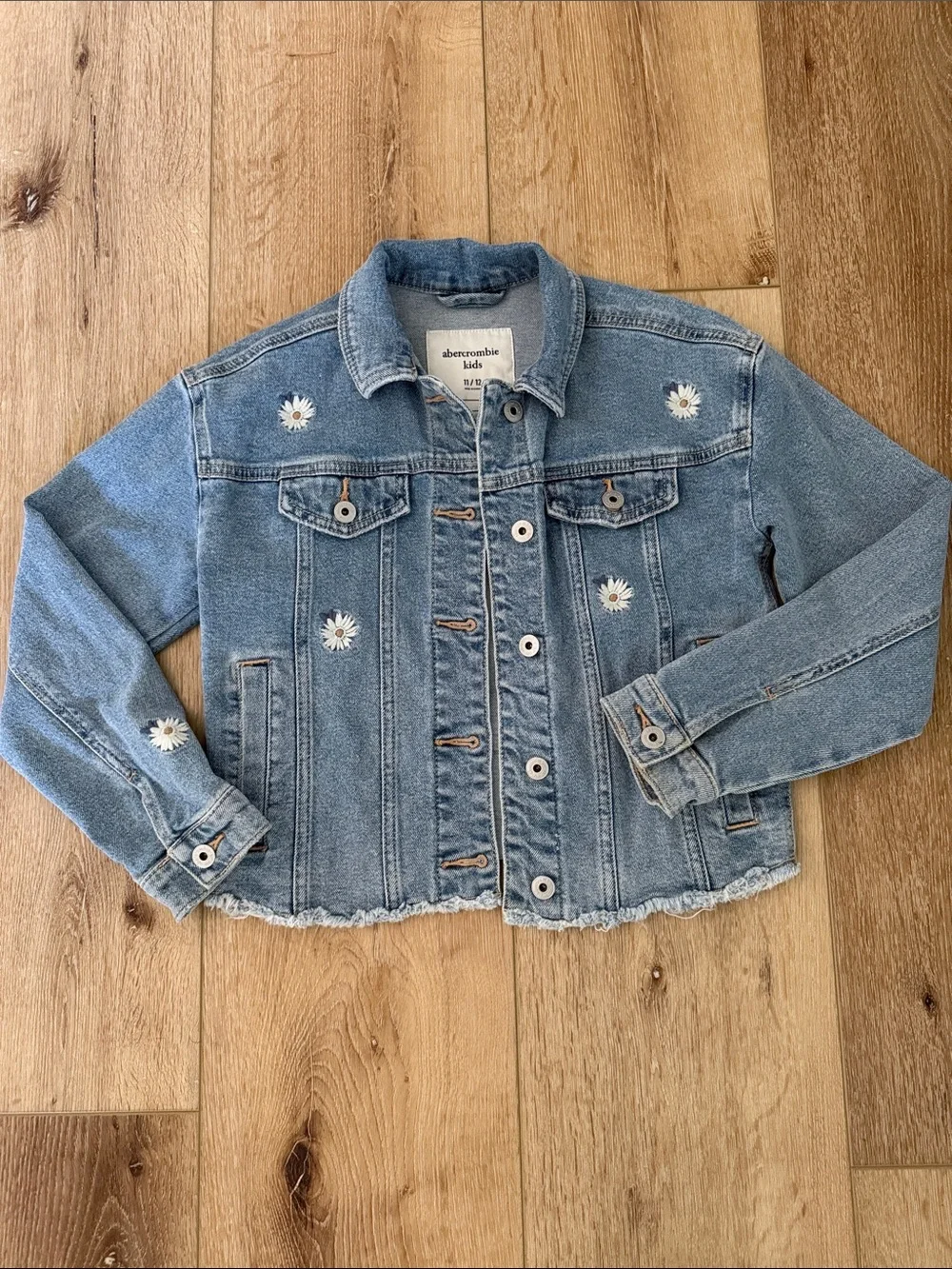 abercrombie kids | light blue denim jacket with daisy embroidery raw hem | 11/12